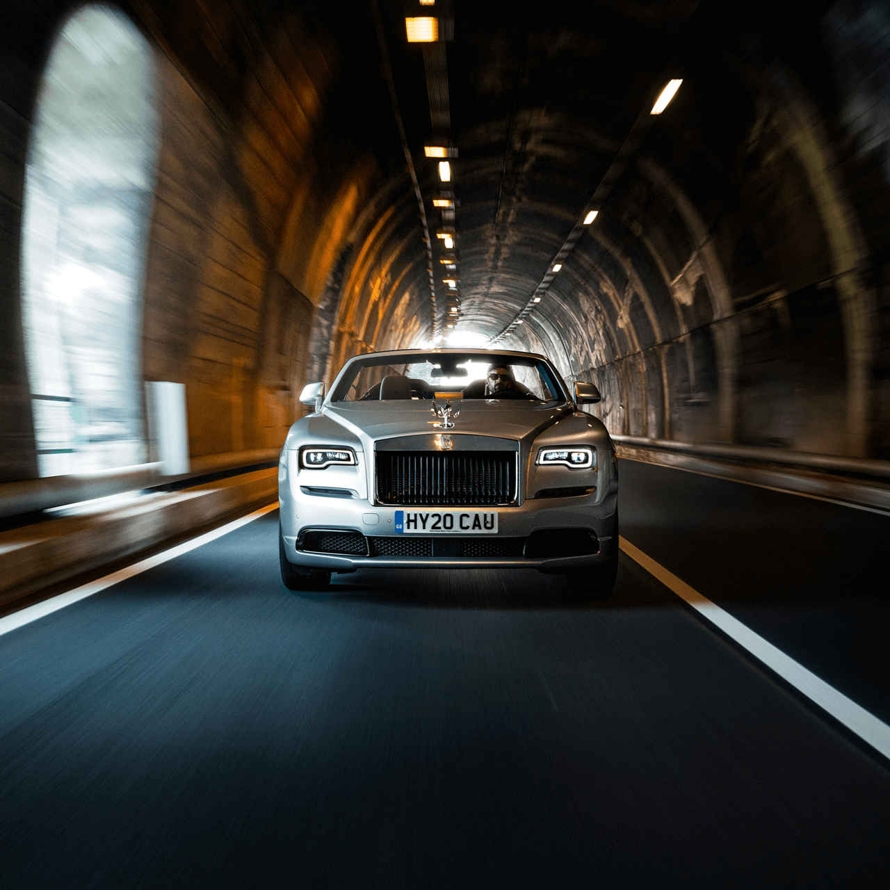 A Rolls Royce travels through a tunnel