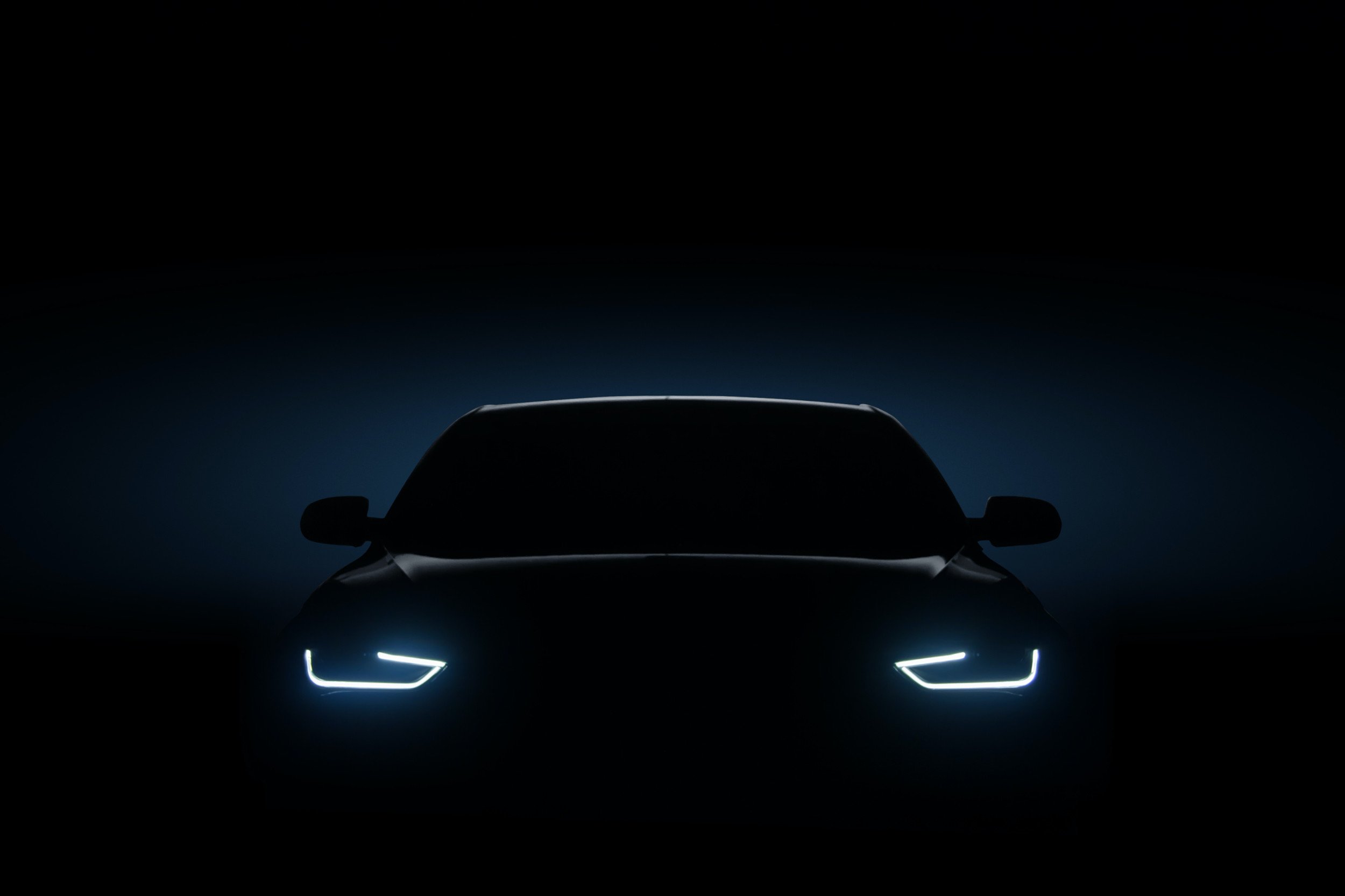 Car in the dark with headlights on